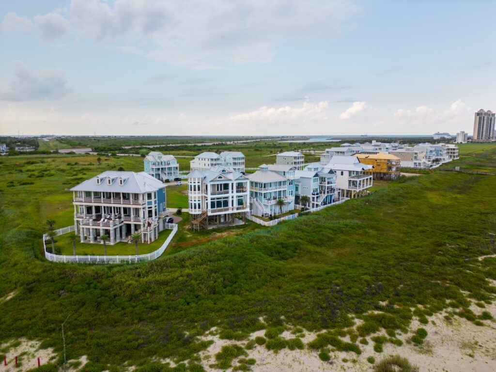 Cost to Build a House in Galveston, TX: The 2026 Pricing Guide aerial,photo,luxury,homes,on,grand,beach,galveston,texas