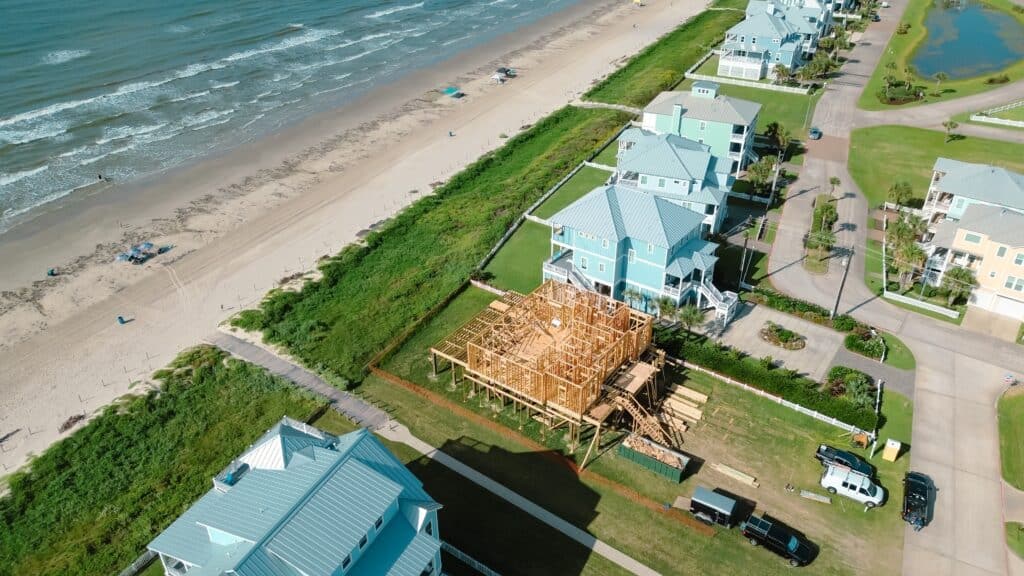 wooden,boardwalk,extending,from,multistory,vacation,homes,,private,beach,access